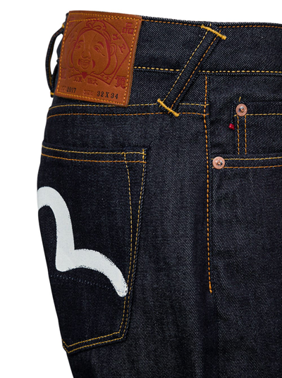 Shop Evisu Blue Denim Jeans With Logo Print