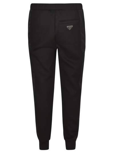 Shop Prada Logo Plaque Ribbed Track Pants In Black