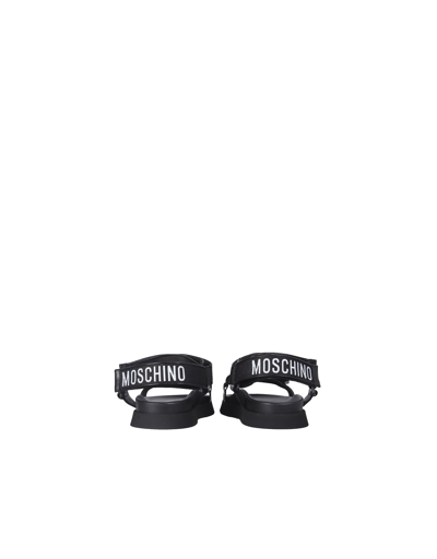 Shop Moschino S Tape Sandals In Black