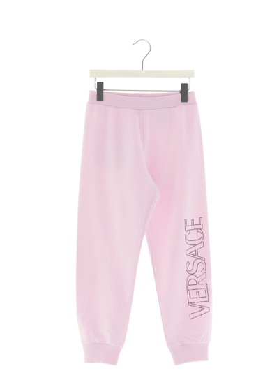 Shop Versace Crystal Logo Sweatpants In Pink