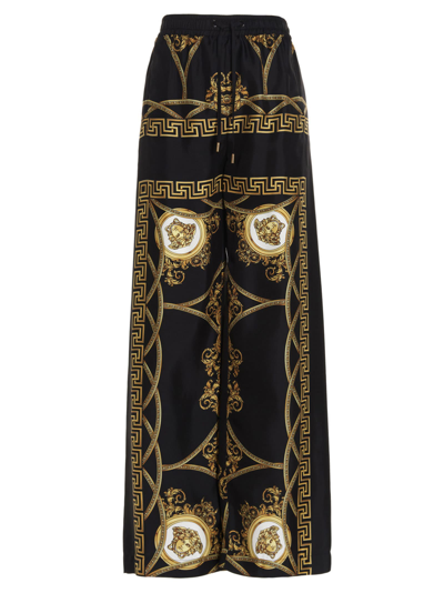 Shop Versace Coupe De Deaux Pants In Black