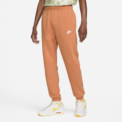 Shop Nike Sportswear Club Fleece Men's Pants In Hot Curry,hot Curry,white