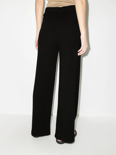 Shop Wolford Mid-rise Flared Trousers In Black