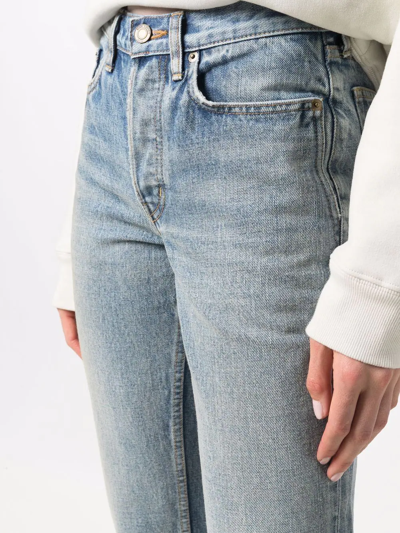 Shop Saint Laurent Washed Cropped Jeans In Blue
