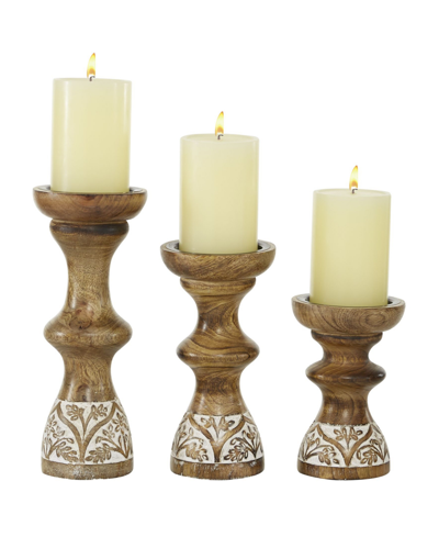 Shop Rosemary Lane Mango Wood Country Cottage Candle Holder, Set Of 3 In Brown