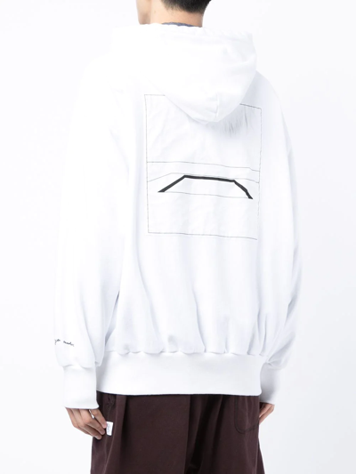 Shop Undercover Graphic Print Drawstring Hoodie In White