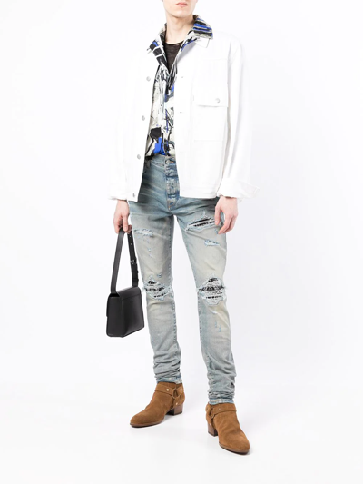 Shop Amiri Mx1 Ripped Skinny Jeans In Blue