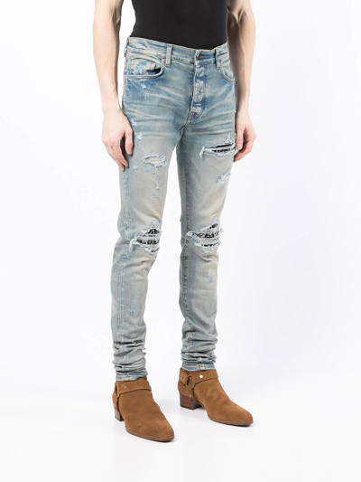 Shop Amiri Mx1 Ripped Skinny Jeans In Blue