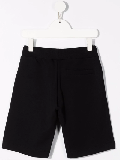 Shop Moschino Logo-stripe Track Shorts In Black