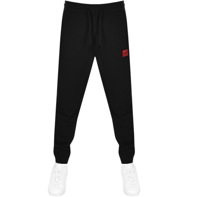 HUGO - Cotton-terry tracksuit bottoms with red logo label