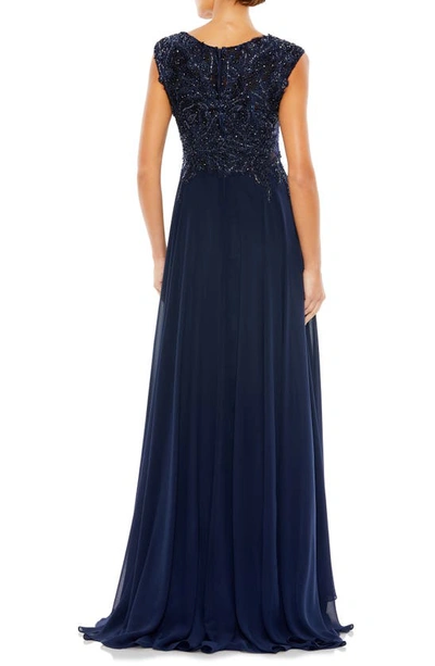 Shop Mac Duggal Sequin Empire Waist Pleated Gown In Navy