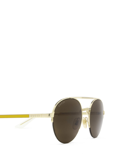 Shop Gucci Gg0984s Gold Sunglasses