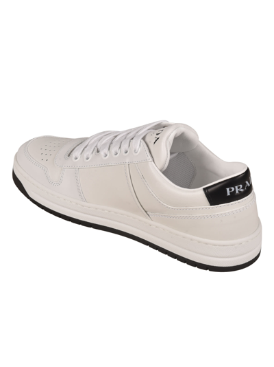 Shop Prada Logo Plaque Perforated Sneakers In White/black