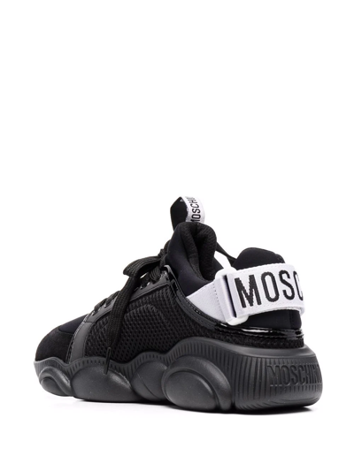 Shop Moschino Logo-stripe Sneakers In Schwarz