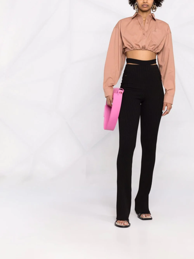 Andreädamo Ribbed-knit Bootcut Trousers In Schwarz