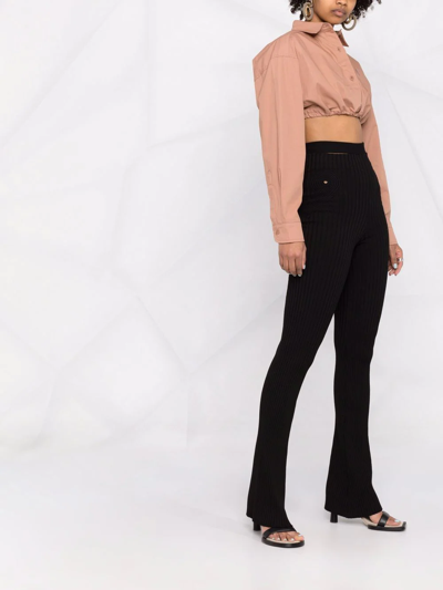 Andreädamo Ribbed-knit Bootcut Trousers In Schwarz