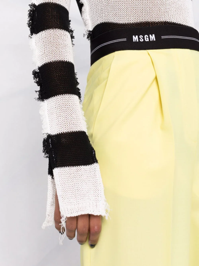 Shop Msgm Logo-waistband Flared Trousers In Gelb
