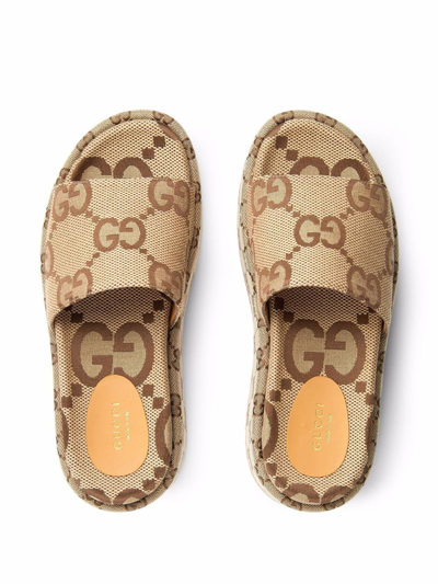 Shop Gucci Maxi Gg Motif Platform Sandals In Brown