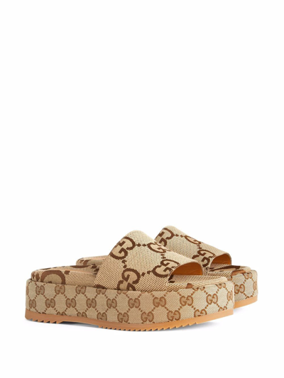 Shop Gucci Maxi Gg Motif Platform Sandals In Brown