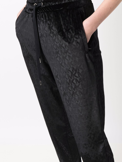Shop Michael Kors Monogram-jacquard Tapered Track Pants In Black