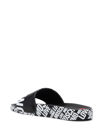 Shop Love Moschino Logo-print Slides In Black