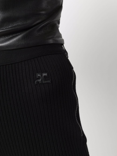 Shop Courrèges Logo Knit Flared Trousers In Schwarz