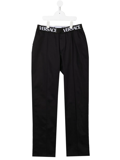 Shop Versace Logo-waistband Straight-leg Trousers In Black