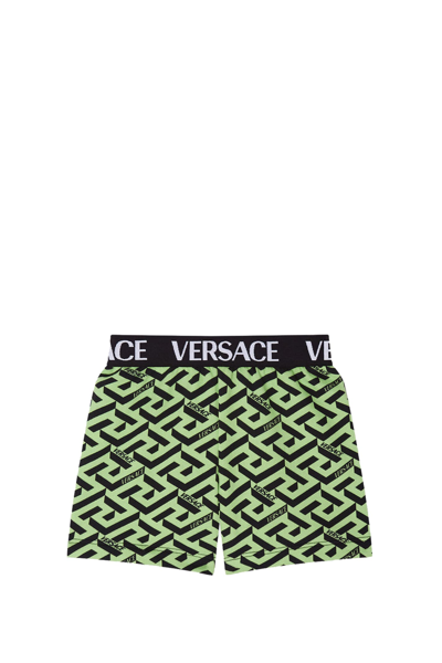 Shop Versace La Greca Shorts In Green