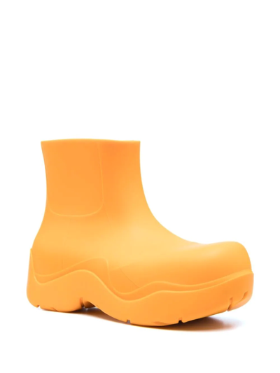 Shop Bottega Veneta Puddle Ankle Boots In Orange