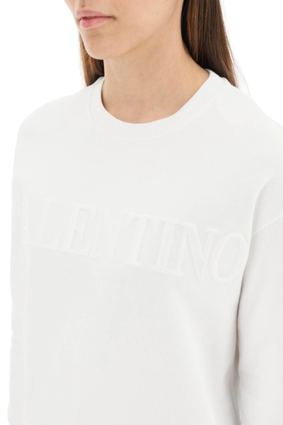 Shop Valentino Sweatshirt With Laminated Embossed Logo In White