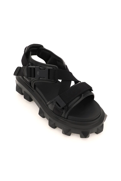 Shop Valentino Trackstud Sandals In Black