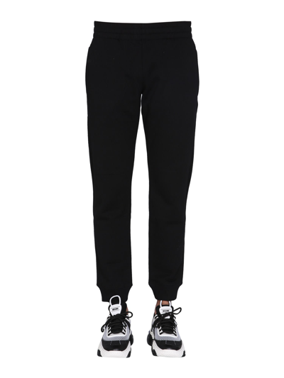 Shop Moschino Jogging Pants With Logo Patch In Nero
