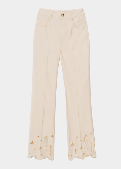 Shop Nanushka Zoey Embroidered Flare Trousers In Creme