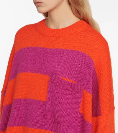 Shop Jw Anderson Striped Sweater In Pink/red