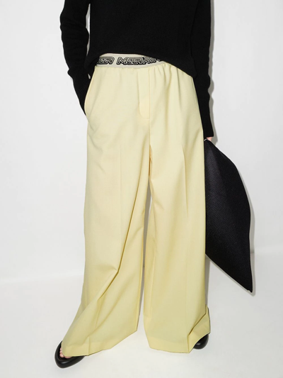 Shop Stella Mccartney Logo-waistband Palazzo Trousers In Yellow