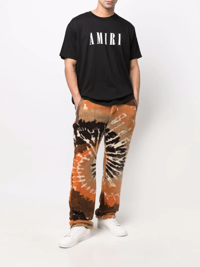 Shop Amiri Tie-dye Faux Shearling Trousers In Orange