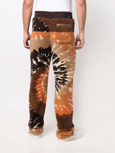 Shop Amiri Tie-dye Faux Shearling Trousers In Orange