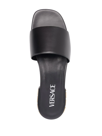 Shop Versace Greca-detail Leather Sandals In Black