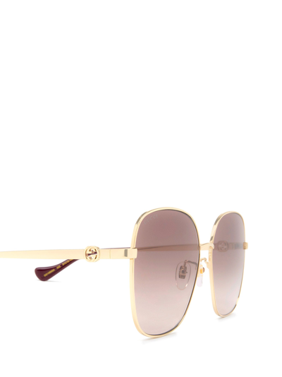 Shop Gucci Eyewear Sunglasses In Gold