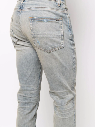 Amiri Logo-patch Stonewashed Skinny Jeans In Blau