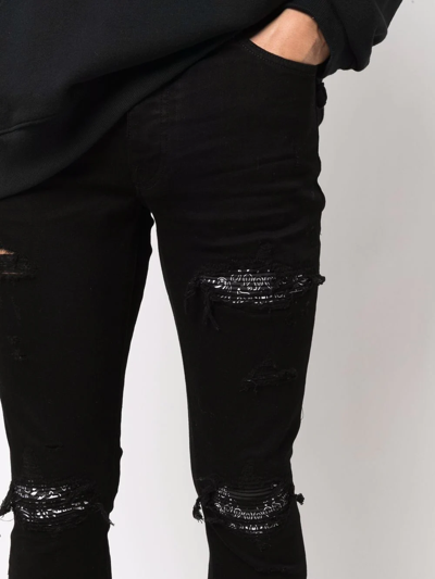 Shop Amiri Ripped-detailing Skinny Jeans In Schwarz