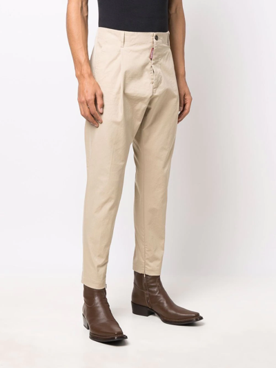 Shop Dsquared2 Cropped Tapered Chinos In Neutrals