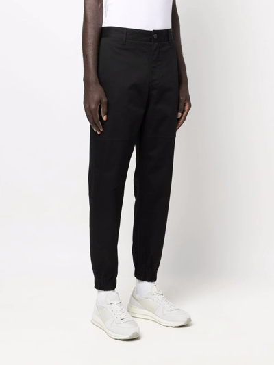 Shop Armani Exchange Tapered Stretch-cotton Trousers In Black