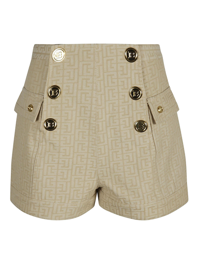 Shop Balmain All-over Logo Button Embellished Shorts In Nude