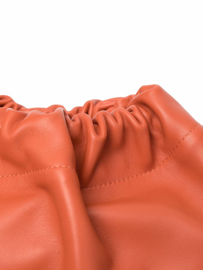 Shop Studio Amelia Maxi Drawstring-fastening Crossbody Bag In Orange