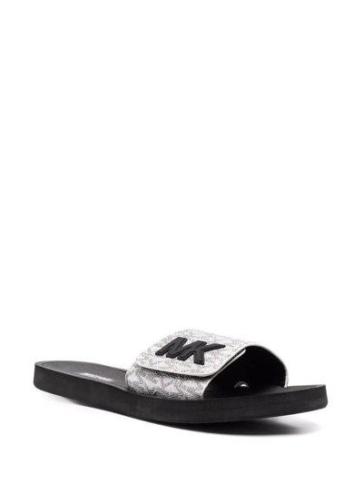 Shop Michael Michael Kors Monogram-pattern Print Slides In Silver