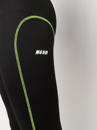 Shop Msgm Logo-print Neon-stitch Leggings In Black