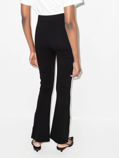 Shop Frame High-waisted Flared Trousers In Black