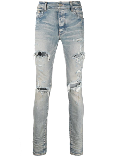 Shop Amiri Distressed Skinny Jeans In Blau