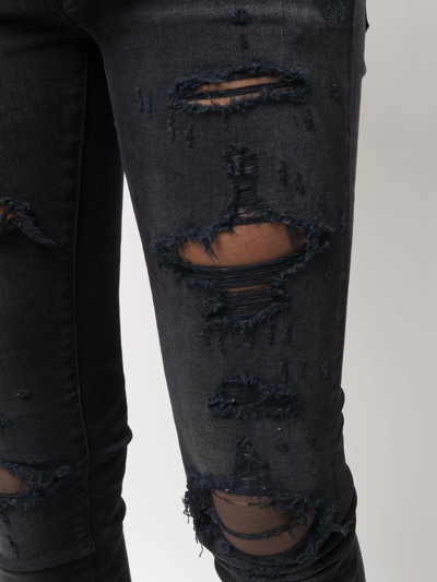 Shop Amiri Distressed Skinny Jeans In Schwarz
